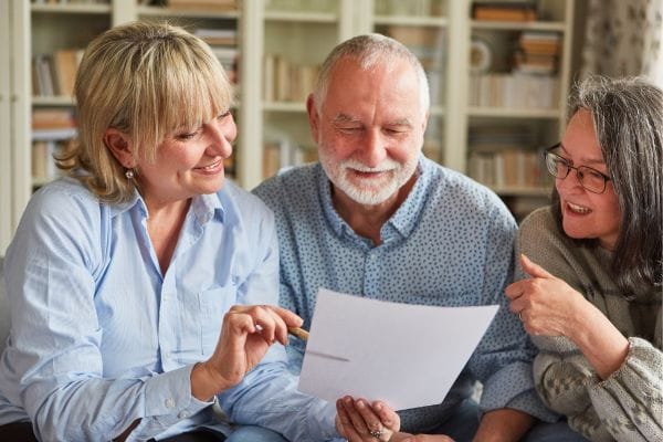 Seniors and Tax Consultant Talk about Contract