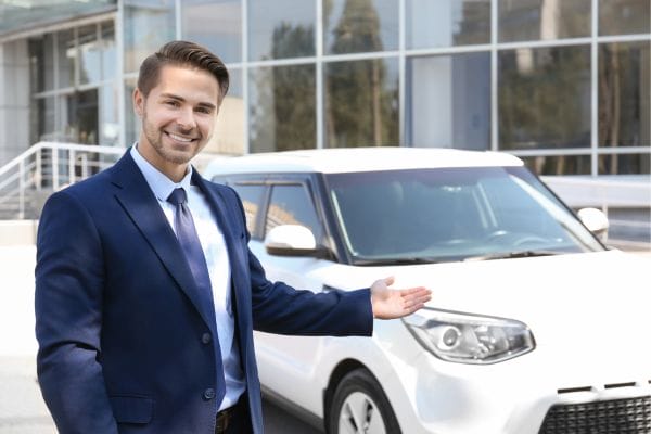 man Presenting a Car Model